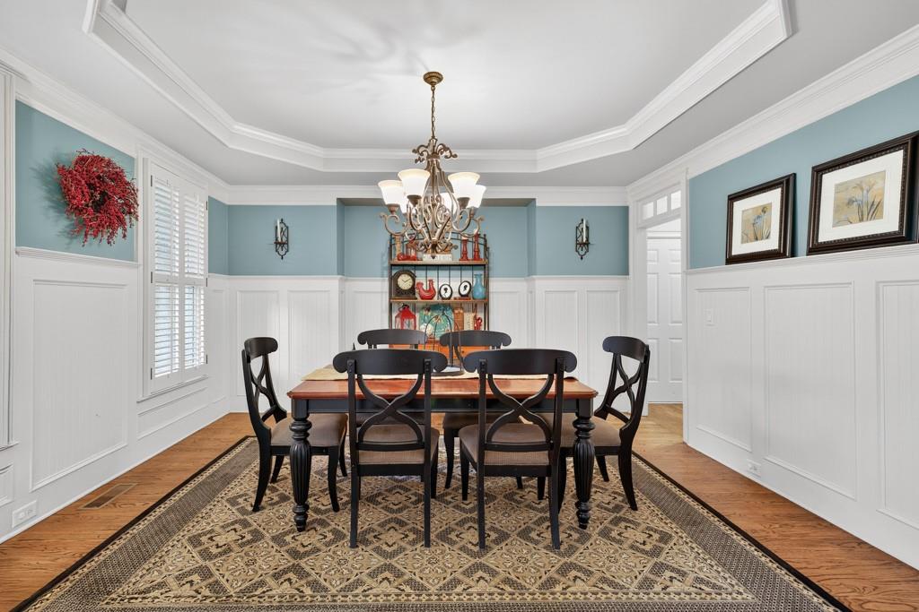 3315 Kylee Dawn Circle Lawrenceville, GA 30045 - Photo 7 of 97 a view of a dining room with furniture window and wooden floor