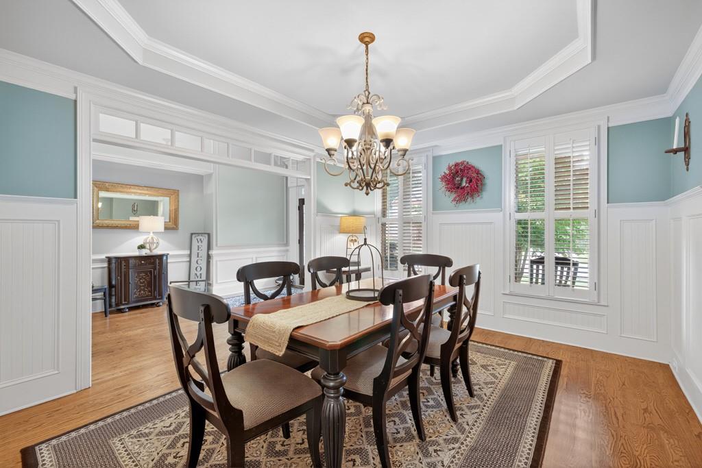 3315 Kylee Dawn Circle Lawrenceville, GA 30045 - Photo 8 of 97 a dining room with furniture a chandelier and window