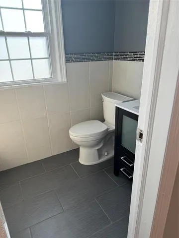 a bathroom with a toilet and a sink