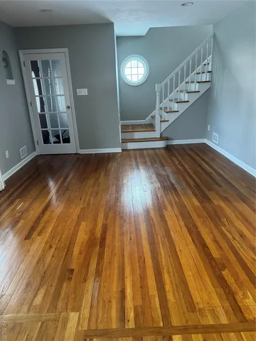 a view of entryway with wooden floor