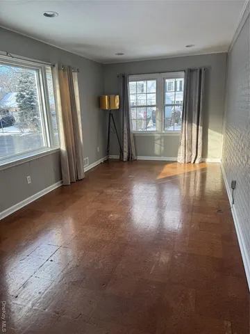 an empty room with floor to ceiling windows and windows