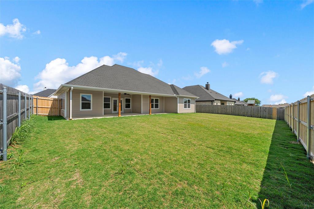 929 Northern Dancer Drive Hewitt, TX 76643 - Photo 31 of 36 a front view of a house with a garden