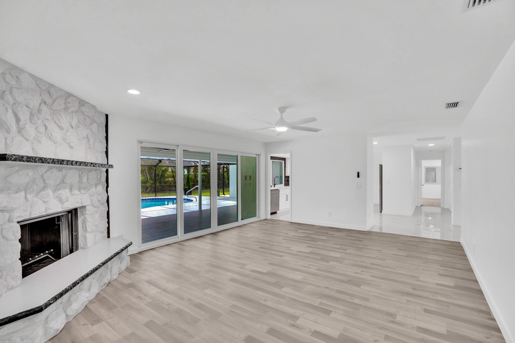 4384 2nd Square Southwest Vero Beach, FL 32968 - Photo 18 of 36 a view of an empty room with a fireplace and a window