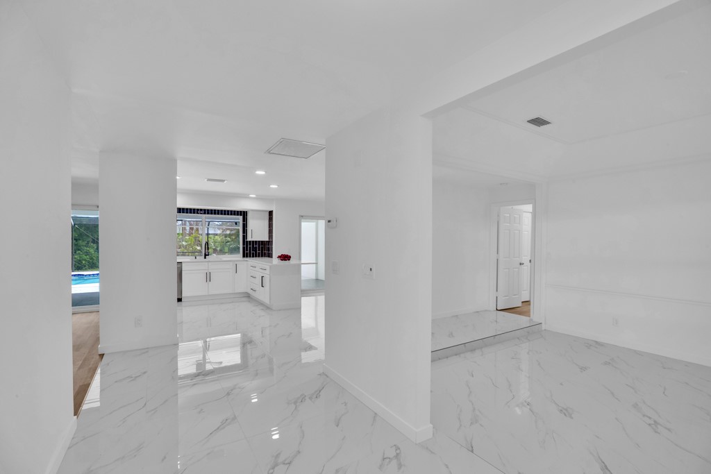 4384 2nd Square Southwest Vero Beach, FL 32968 - Photo 30 of 36 a view of a living room hardwood floor and a kitchen