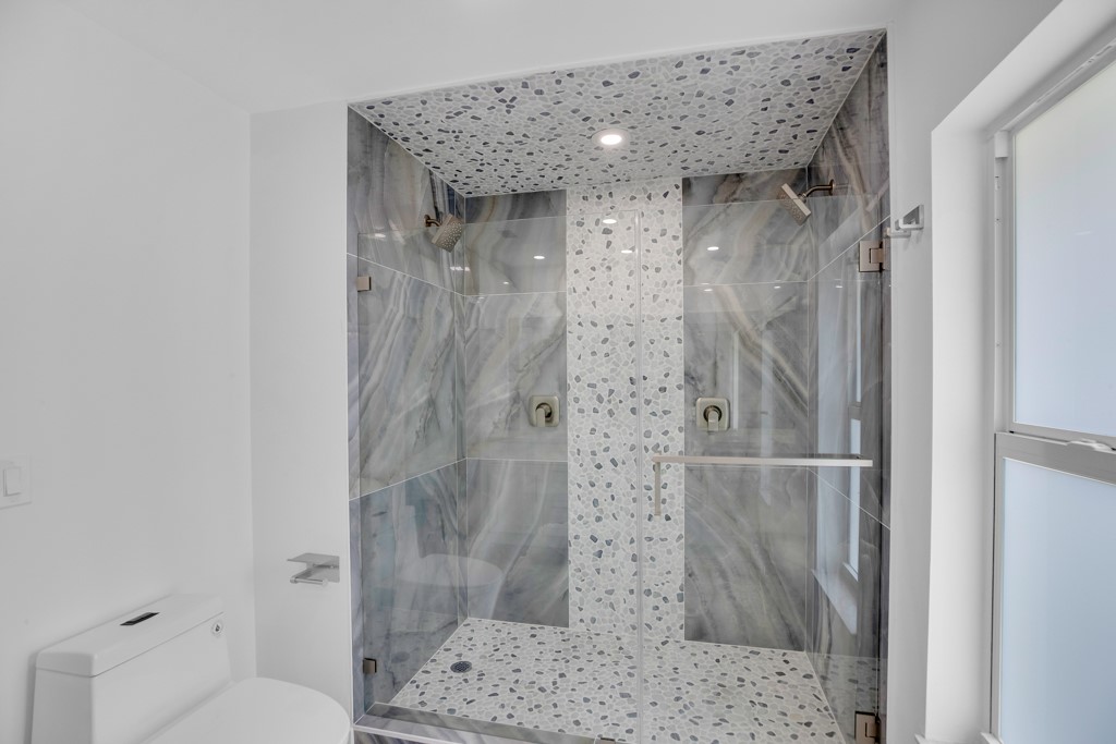 4384 2nd Square Southwest Vero Beach, FL 32968 - Photo 31 of 36 a bathroom with a shower