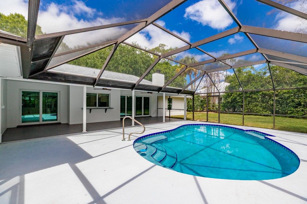 4384 2nd Square Southwest Vero Beach, FL 32968 - Photo 33 of 36 a view of a swimming pool with a patio