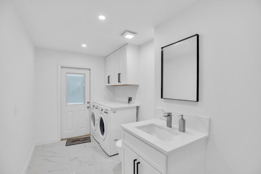 4384 2nd Square Southwest Vero Beach, FL 32968 - Photo 36 of 36 a bathroom with a sink vanity and mirror