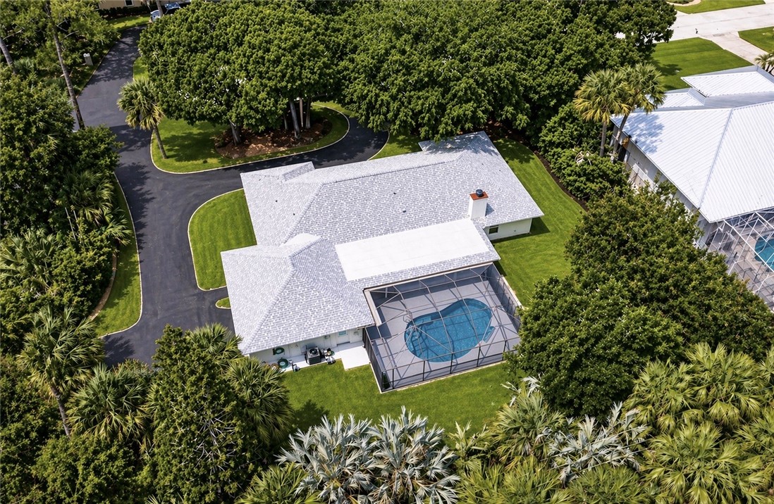 4384 2nd Square Southwest Vero Beach, FL 32968 - Photo 4 of 36 an aerial view of a house with a garden