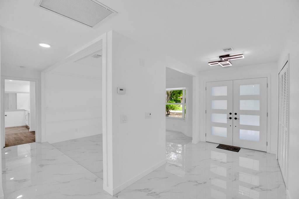 4384 2nd Square Southwest Vero Beach, FL 32968 - Photo 7 of 36 a view of an entryway with a chandelier