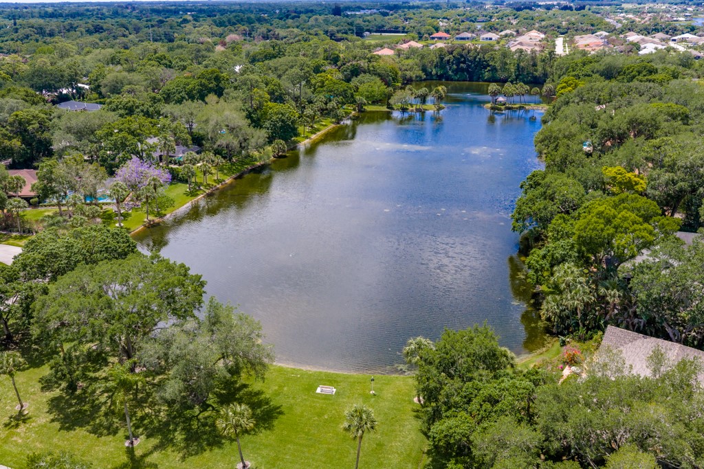 4384 2nd Square Southwest Vero Beach, FL 32968 - Photo 9 of 36 a view of a lake with a yard