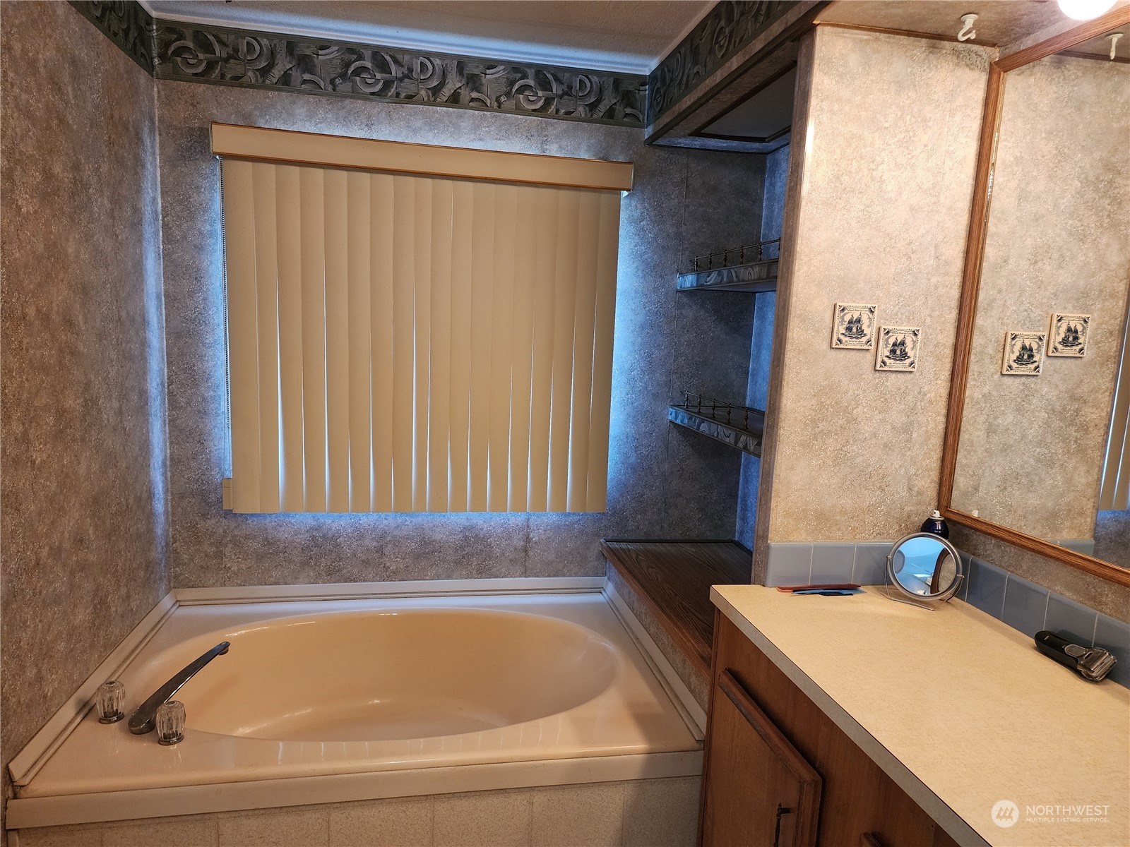 23706 Lake Drive West Bothell, WA 98021 - Photo 13 of 24 a bathroom with a sink and a bathtub