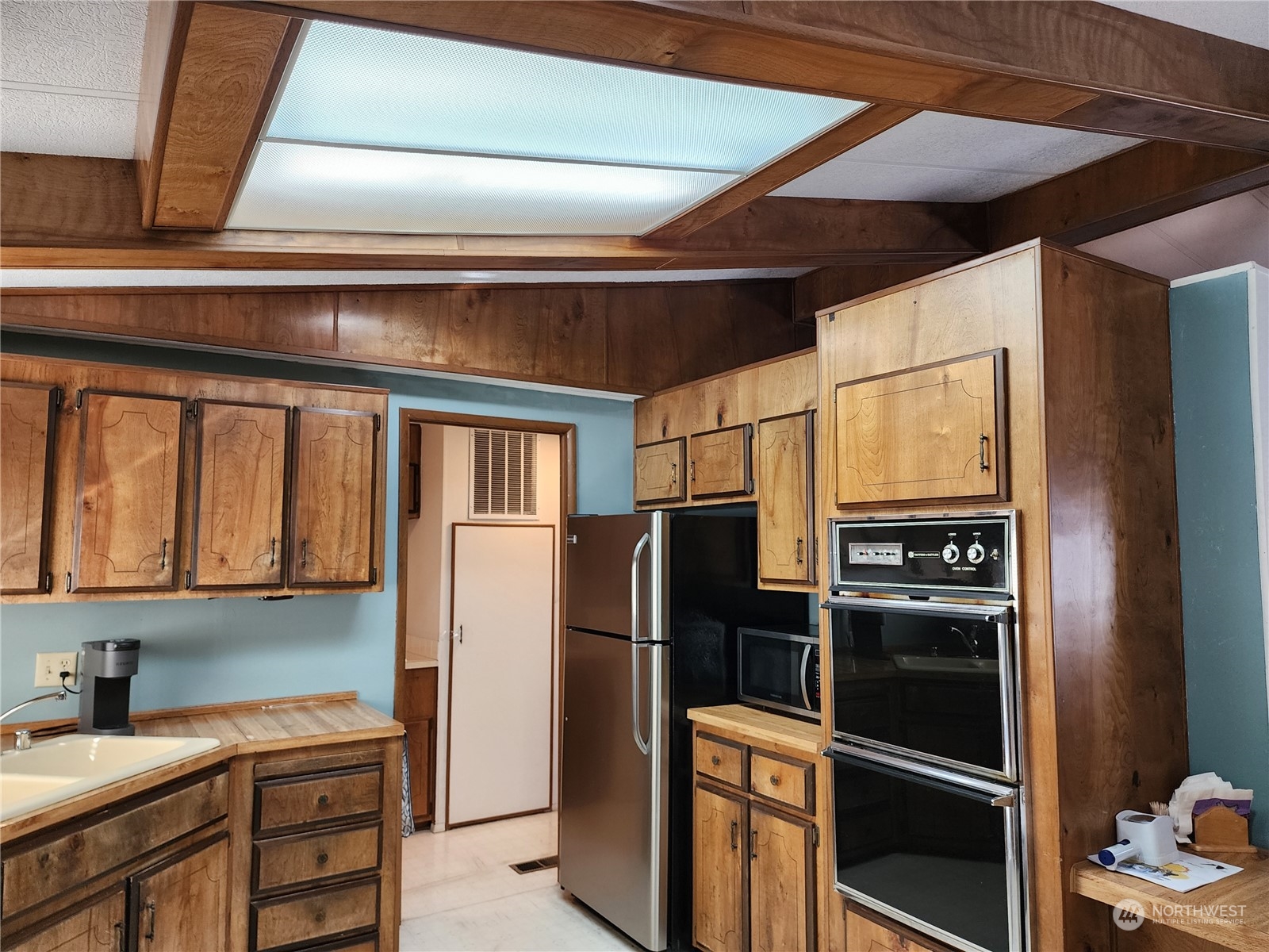 23706 Lake Drive West Bothell, WA 98021 - Photo 16 of 24 a kitchen with stainless steel appliances granite countertop a refrigerator and a stove