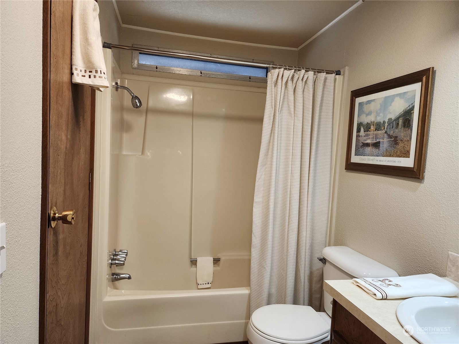 23706 Lake Drive West Bothell, WA 98021 - Photo 18 of 24 a bathroom with a toilet and a shower