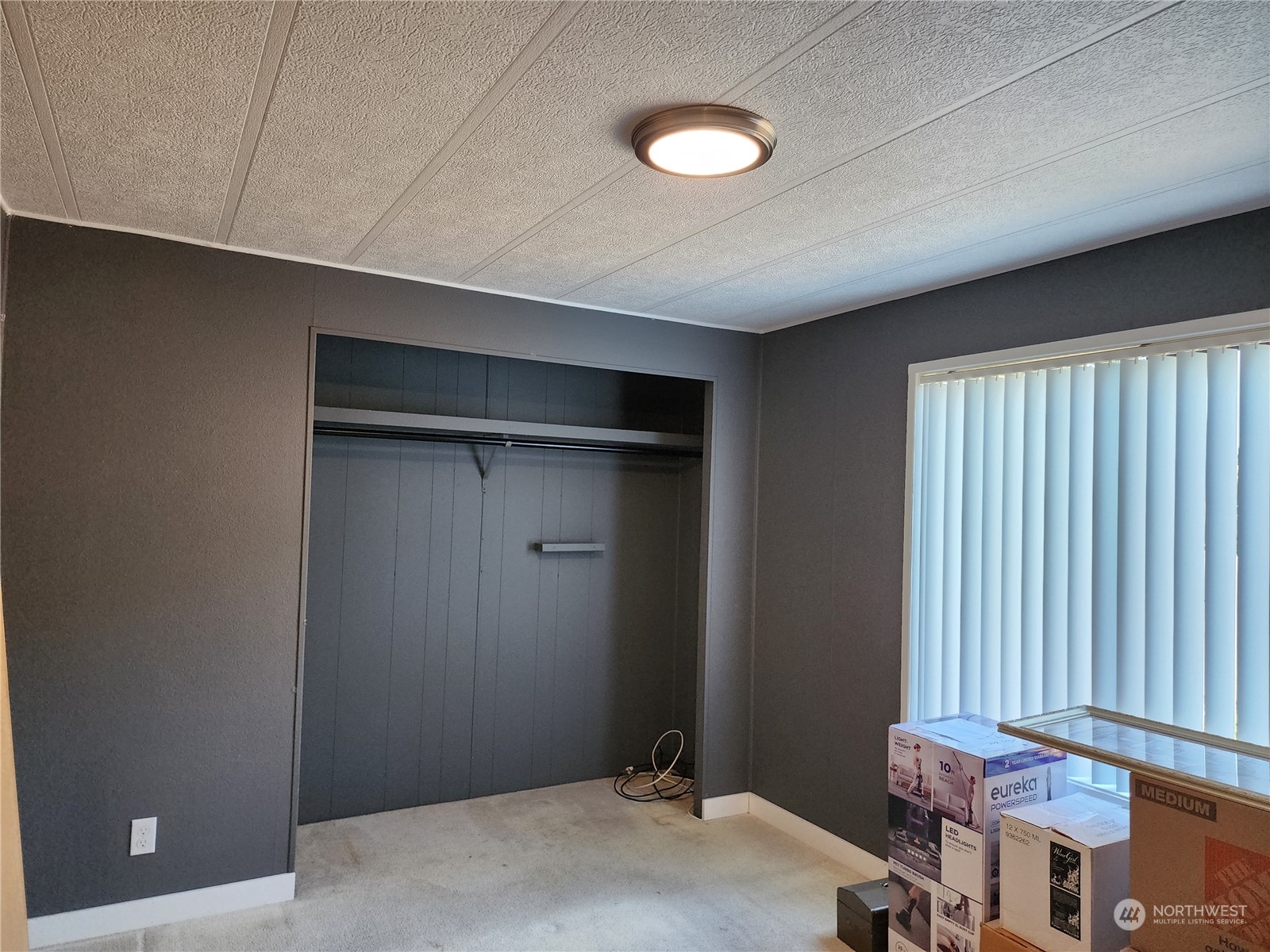23706 Lake Drive West Bothell, WA 98021 - Photo 19 of 24 a bedroom with a bed and a window