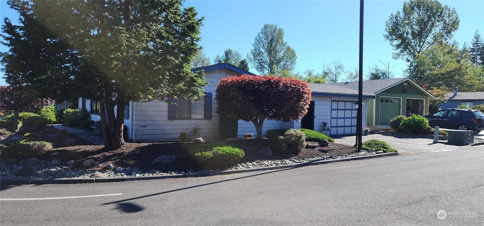 23706 Lake Drive West Bothell, WA 98021 - Photo 20 of 24 a front view of a house with garden