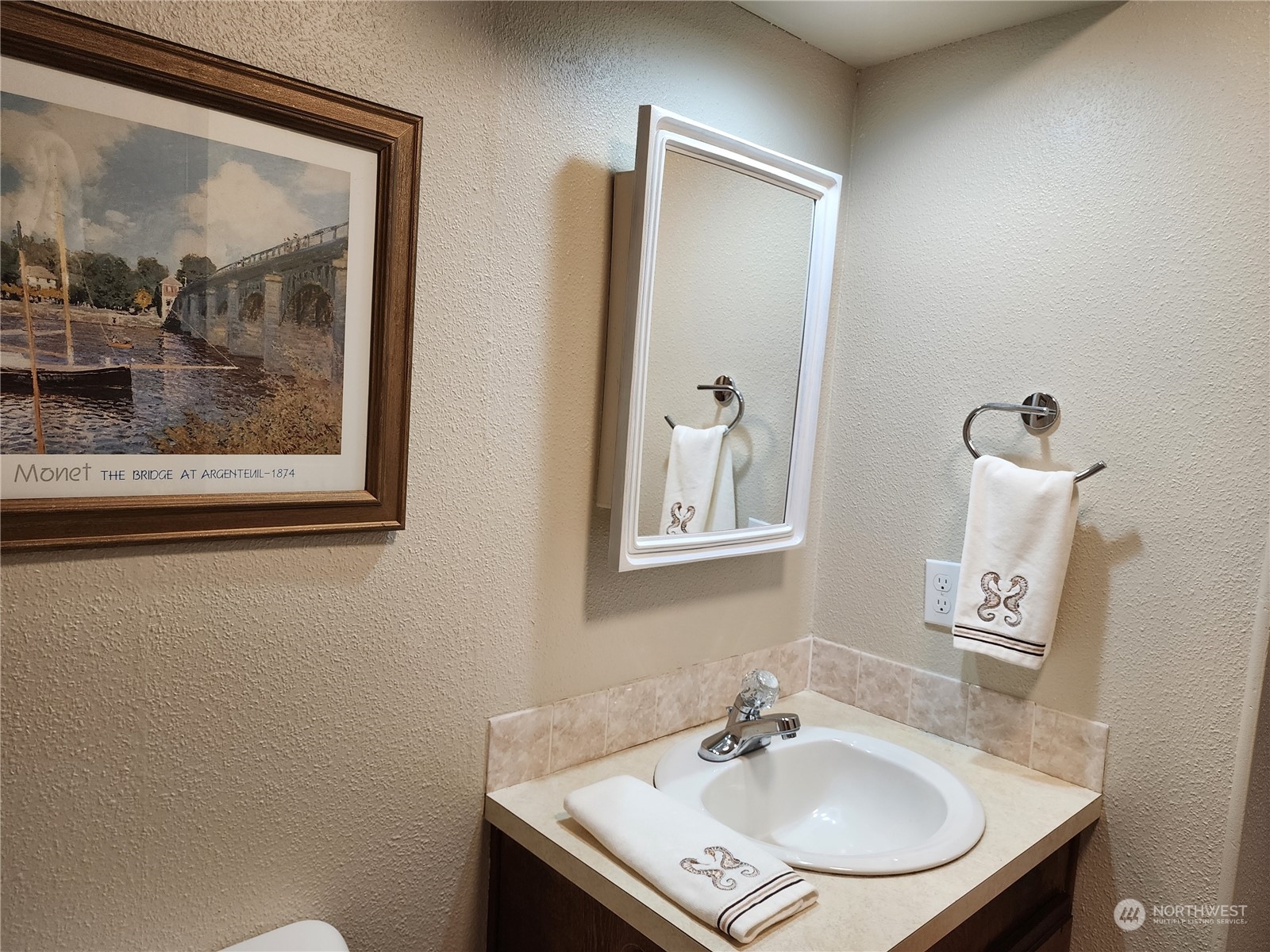 23706 Lake Drive West Bothell, WA 98021 - Photo 6 of 24 a bathroom with a sink and a mirror