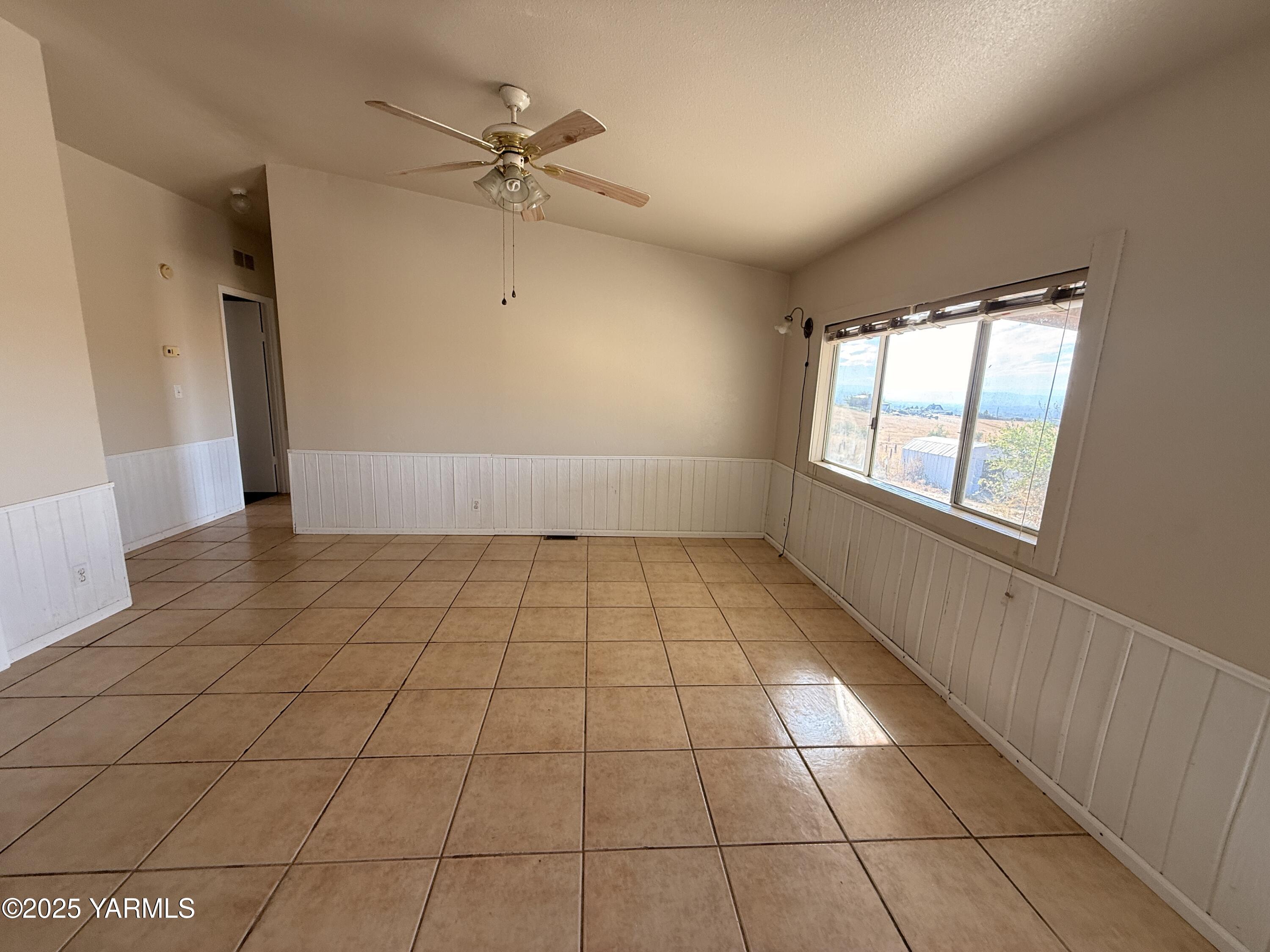 670 Hidden Valley Road Zillah, WA 98953 - Photo 7 of 17 a view of an empty room and window