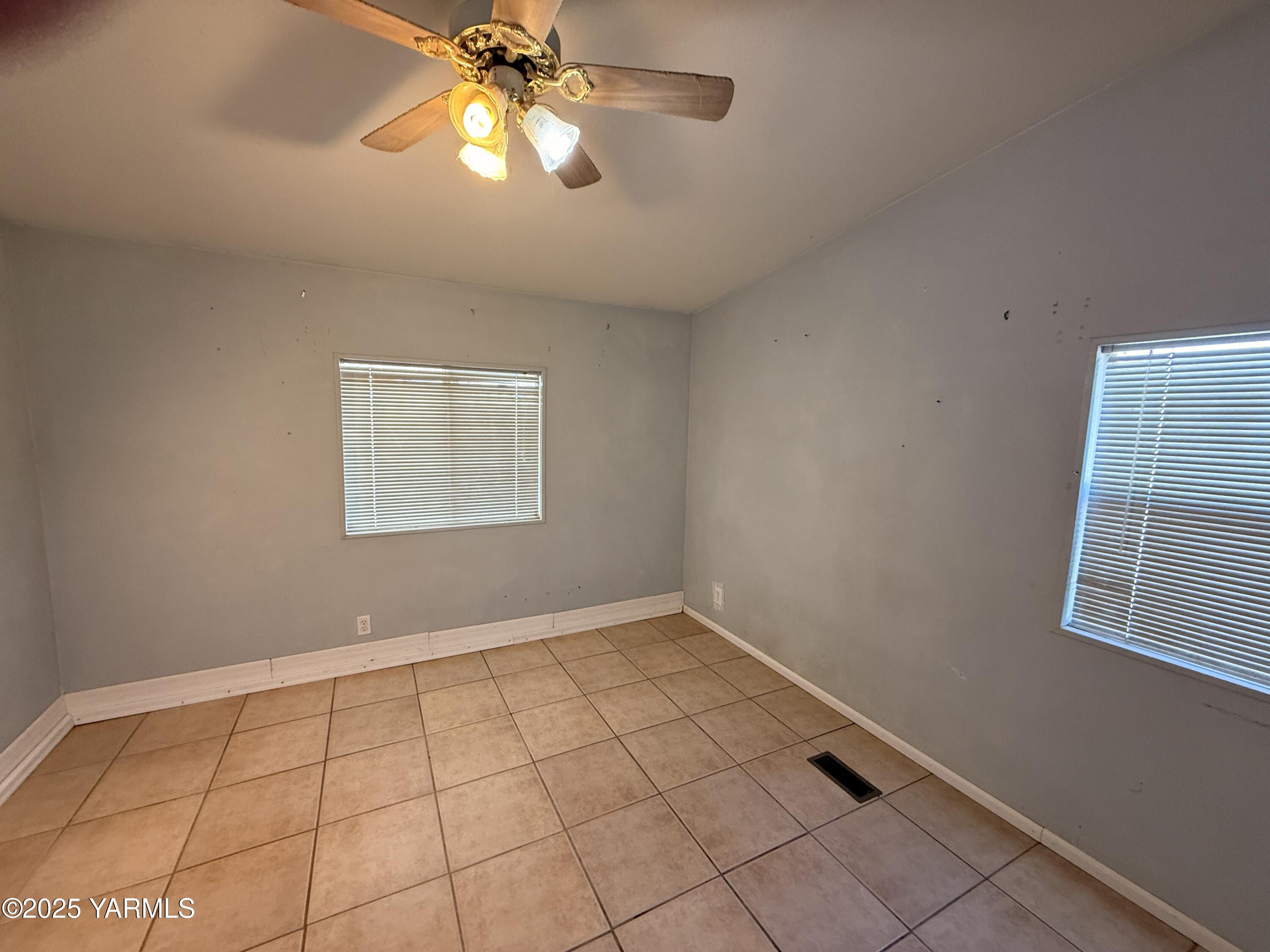 670 Hidden Valley Road Zillah, WA 98953 - Photo 9 of 17 a view of an empty room with a window