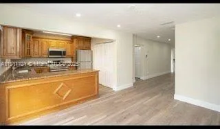 a spacious bathroom with a sink mirror and
