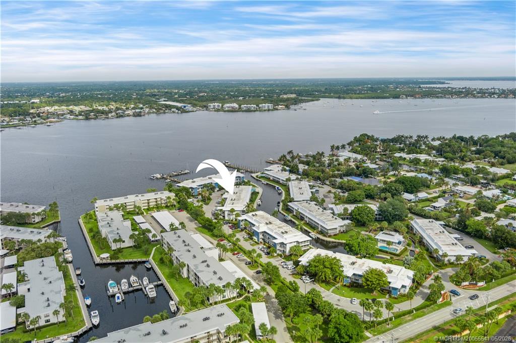 1866 Southwest Palm City Road, Unit 204 Stuart, FL 34994 - Photo 38 of 38 a view of a lake with a table