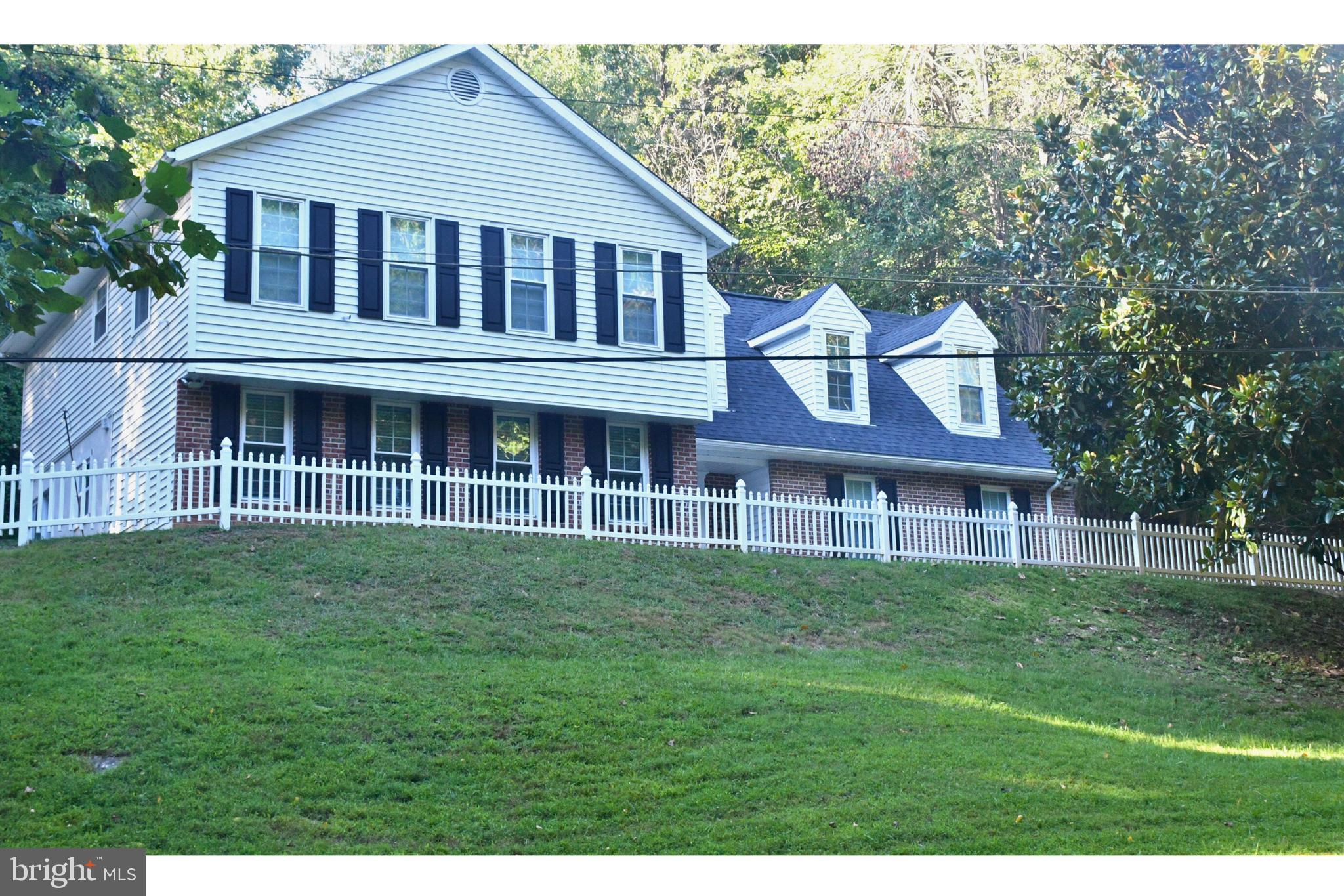 17930 Masemore Road Parkton, MD 21120 - Photo 46 of 46 a front view of a house with a garden
