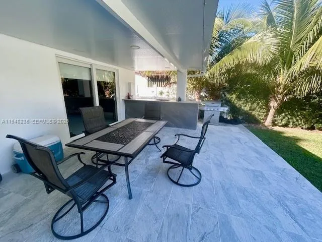 a living room with patio furniture