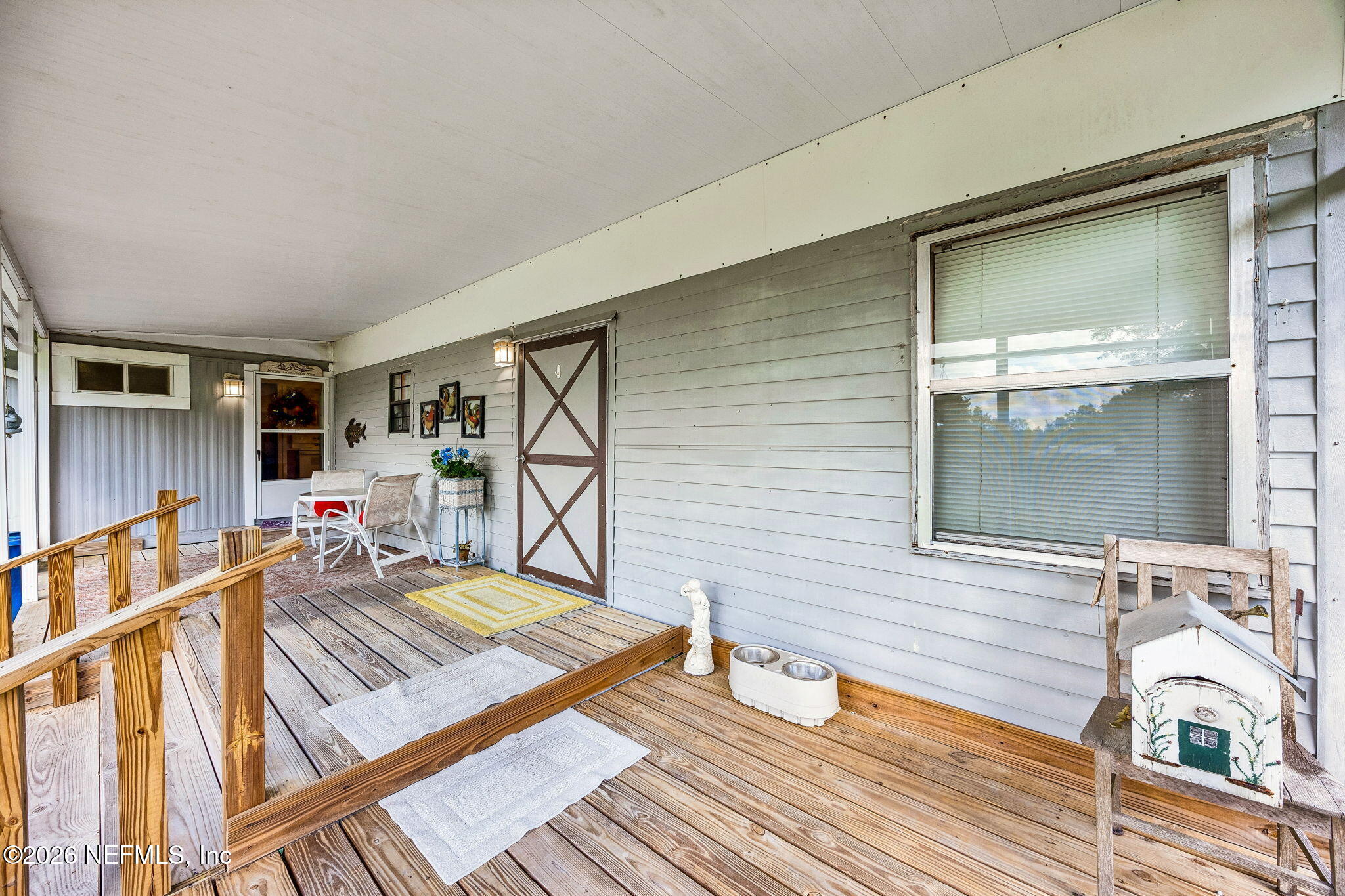 15690 Sears Road Jacksonville, FL 32218 - Photo 18 of 27 a view of a living room and a wooden deck