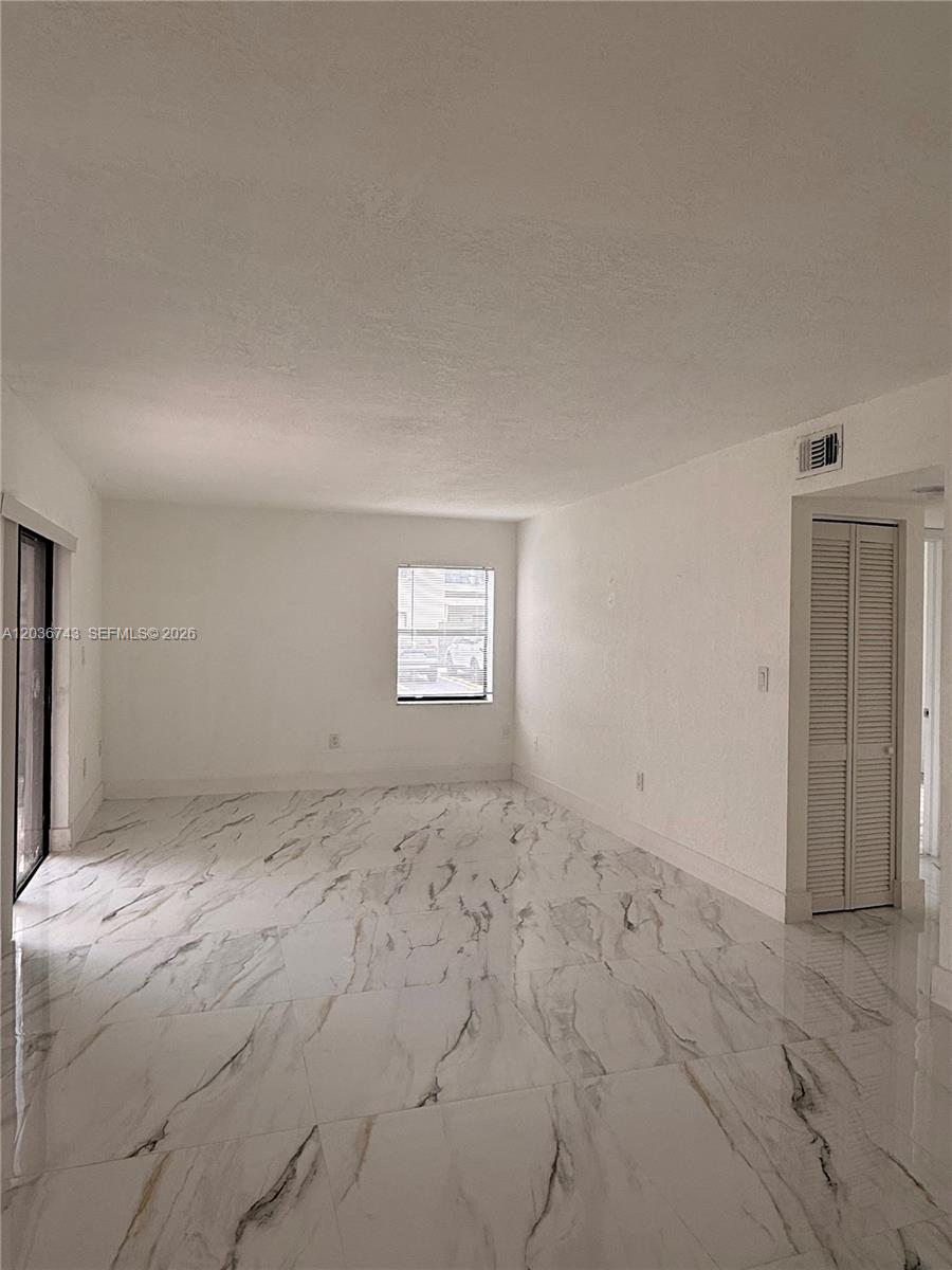 10875 Northwest 7th Street, Unit 1136 Miami, FL 33172 - Photo 6 of 25 a view of a big room with window