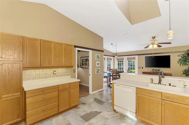 a spacious bathroom with a double vanity sink and mirror