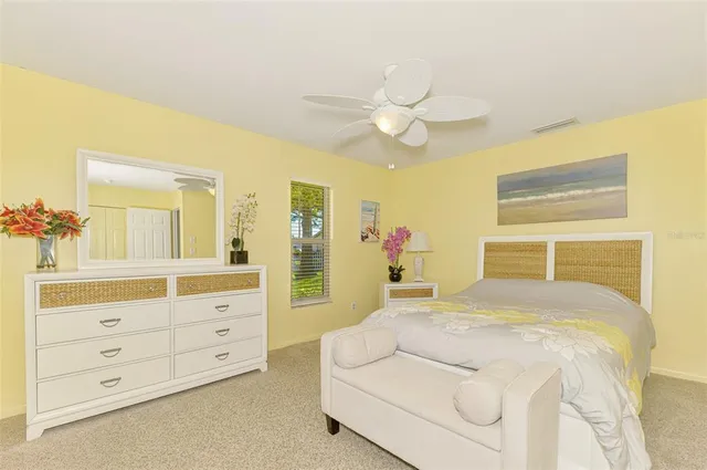 a bedroom with a bed and a dresser