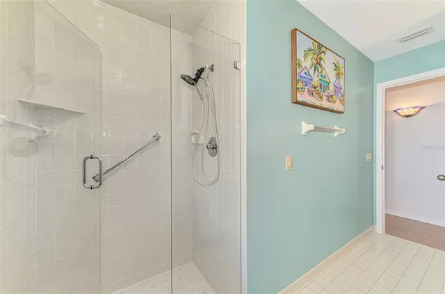 a bathroom with a picture on the wall