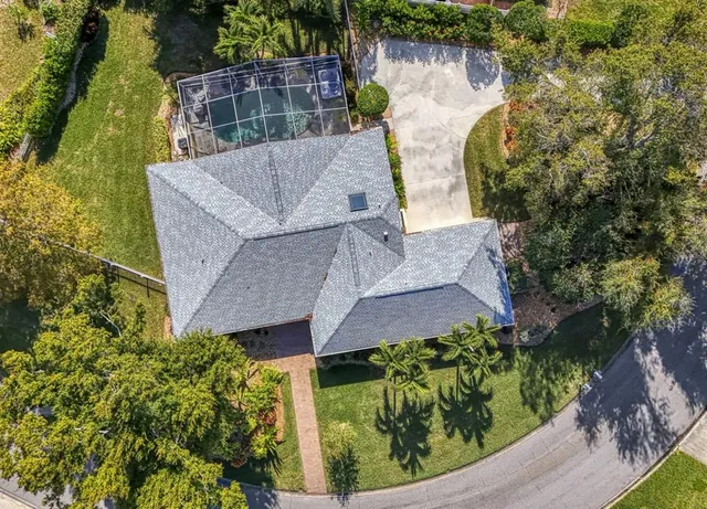 a view of a house with swimming pool and a yard