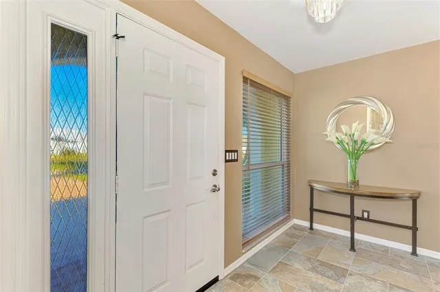 a room with painting and a table