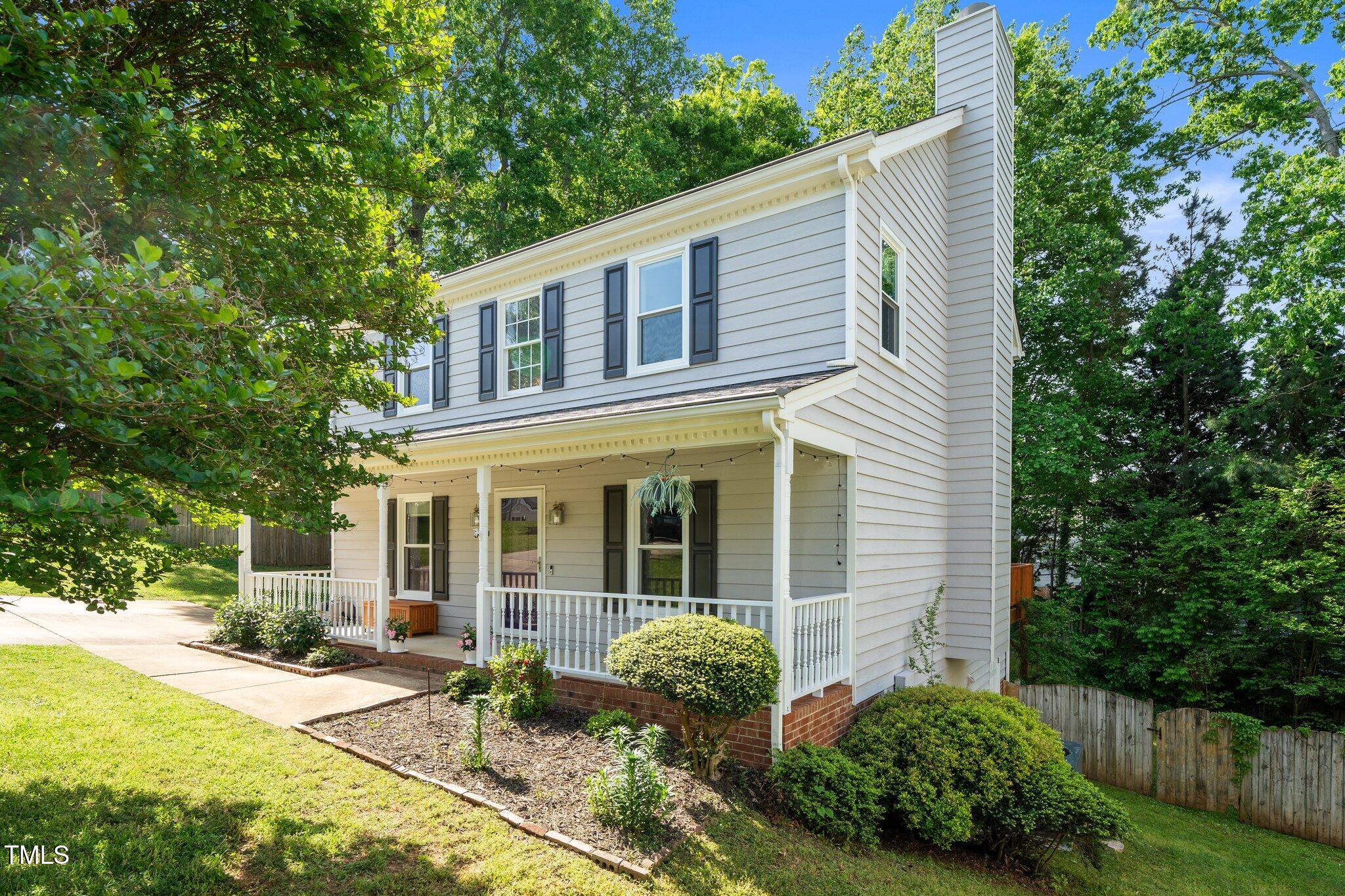 8009 Tobin Place Raleigh, NC 27612 - Photo 2 of 29 a view of a house with backyard and garden
