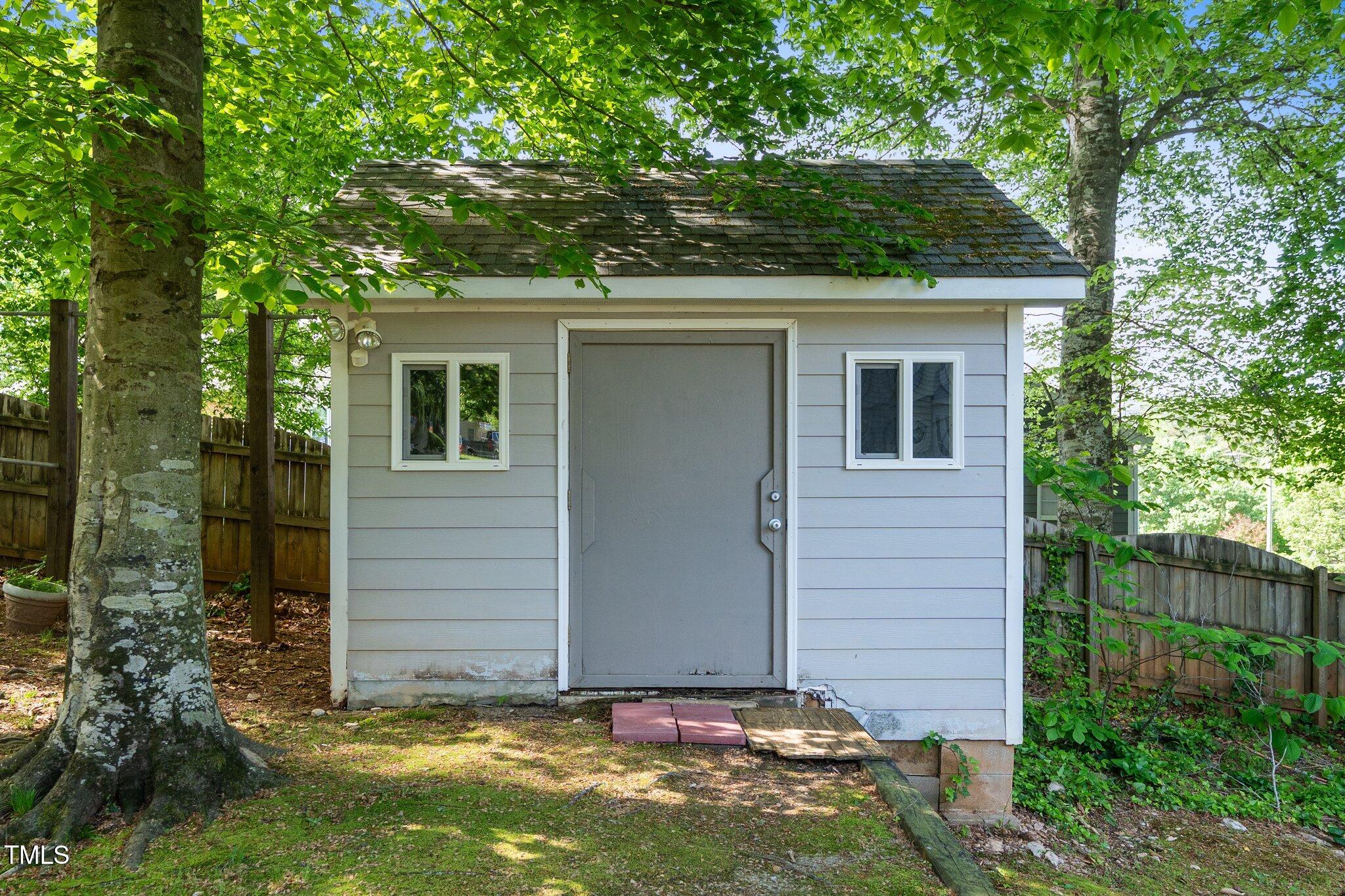 8009 Tobin Place Raleigh, NC 27612 - Photo 25 of 29 front view of a house with a yard