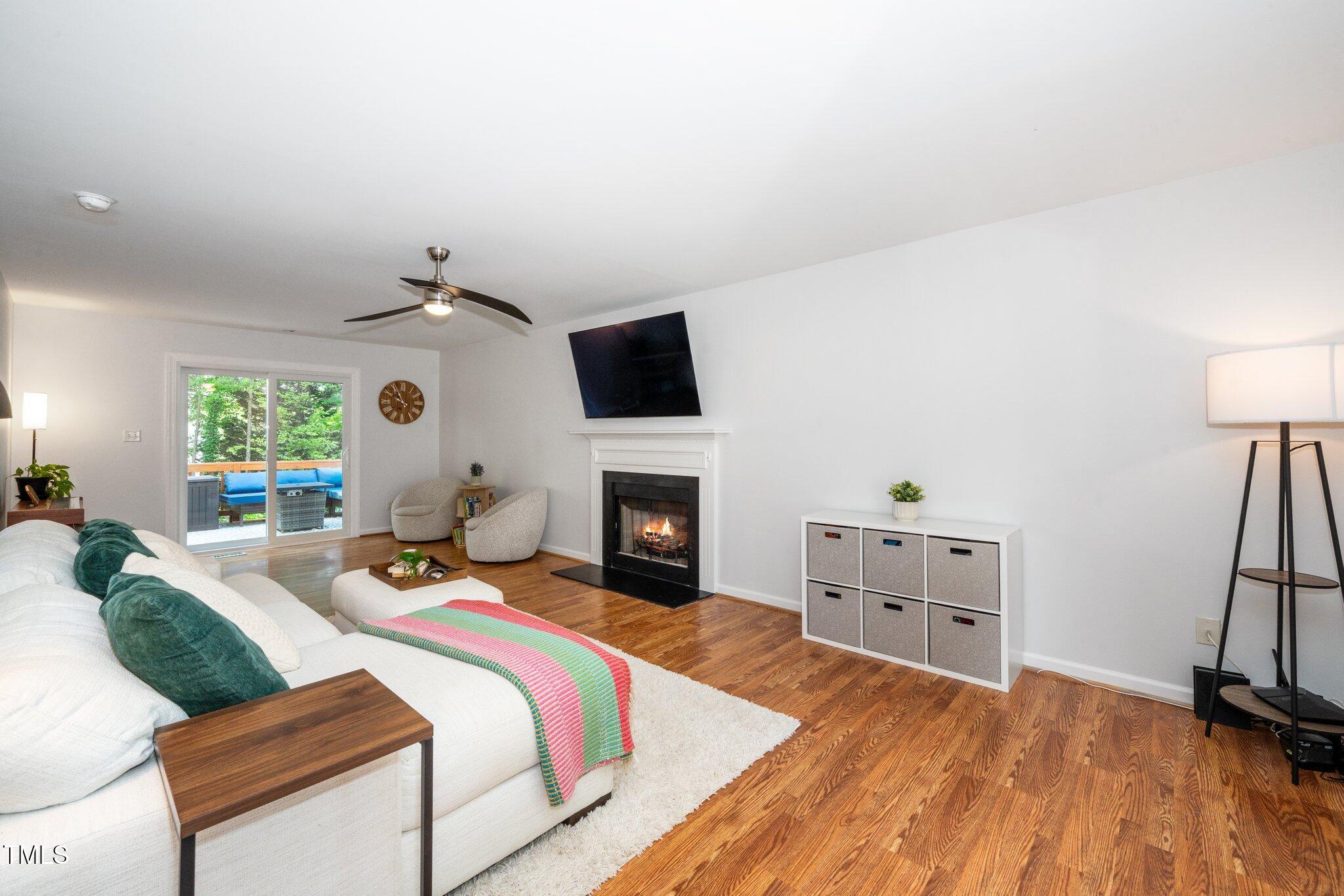 8009 Tobin Place Raleigh, NC 27612 - Photo 5 of 29 a bed room with a bed and a fireplace