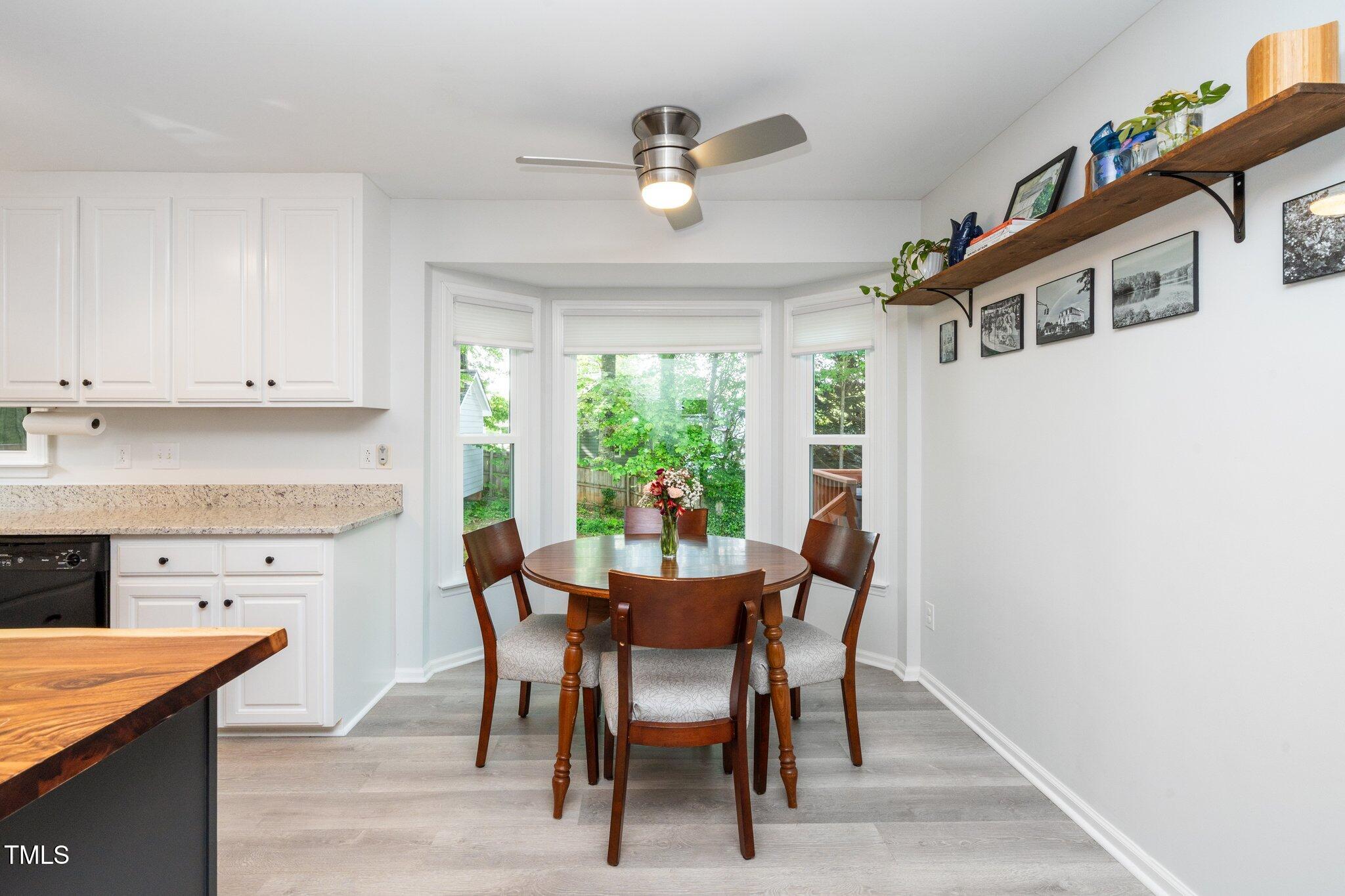 8009 Tobin Place Raleigh, NC 27612 - Photo 9 of 29 a view of a dining room with furniture and a window