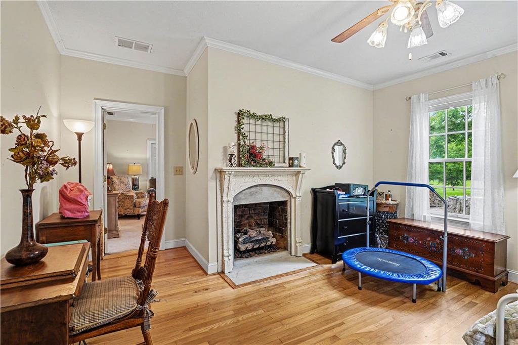 355 Inman Road Hampton, GA 30228 - Photo 26 of 47 a living room with furniture and a fireplace