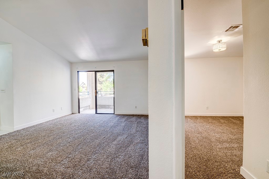 5121 South Lindell Road, Unit 206 Las Vegas, NV 89118 - Photo 12 of 34 Spare room with carpet flooring and baseboards
