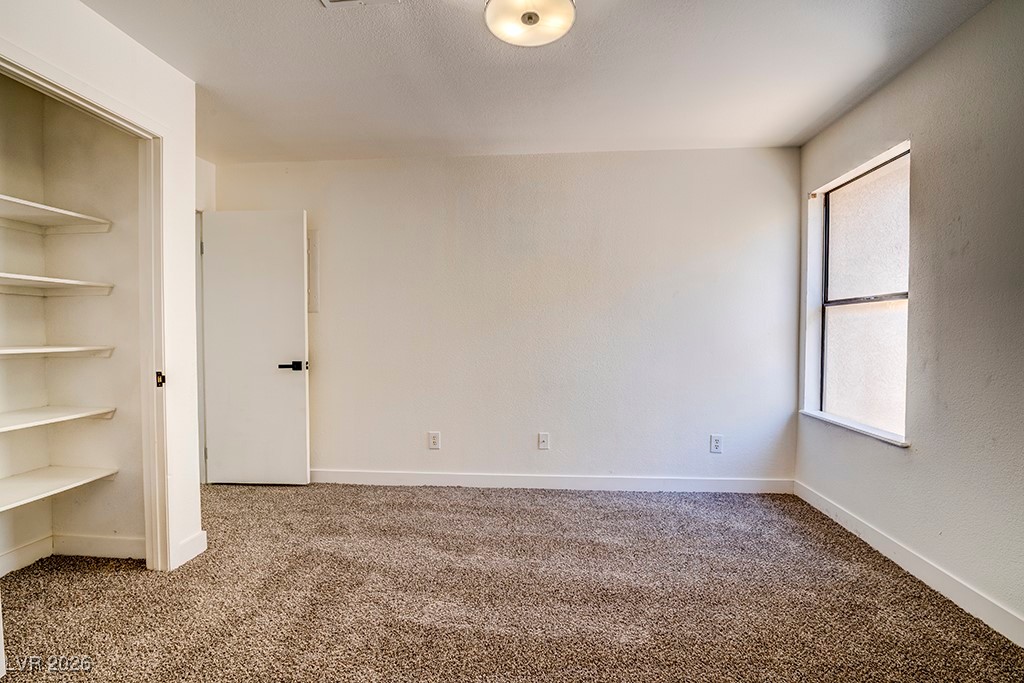 5121 South Lindell Road, Unit 206 Las Vegas, NV 89118 - Photo 17 of 34 Unfurnished bedroom with carpet and baseboards