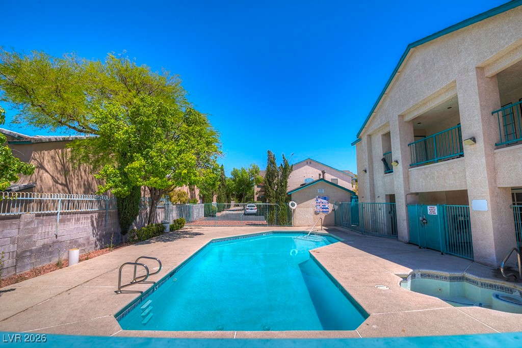 5121 South Lindell Road, Unit 206 Las Vegas, NV 89118 - Photo 2 of 34 Community pool with a patio area