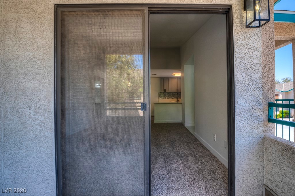 5121 South Lindell Road, Unit 206 Las Vegas, NV 89118 - Photo 24 of 34 Entrance to property with stucco siding