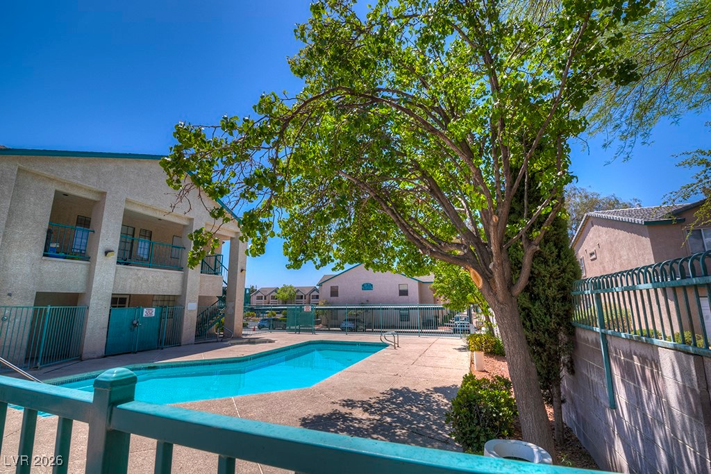 5121 South Lindell Road, Unit 206 Las Vegas, NV 89118 - Photo 30 of 34 Community pool with a residential view, a balcony, and a patio area