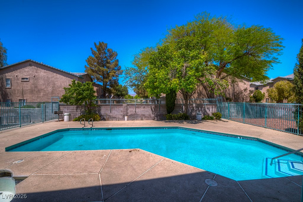 5121 South Lindell Road, Unit 206 Las Vegas, NV 89118 - Photo 31 of 34 Community pool with a patio area