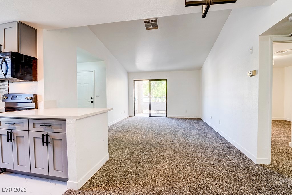 5121 South Lindell Road, Unit 206 Las Vegas, NV 89118 - Photo 6 of 34 Unfurnished living room with light carpet