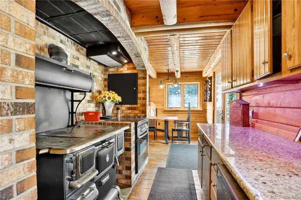 a kitchen with a stove and a sink