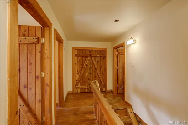 a view of entryway with wooden floor