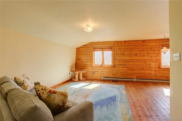 a view of livingroom with couch and lounge chair