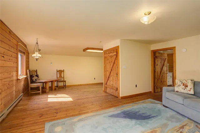 a living room with furniture and a rug