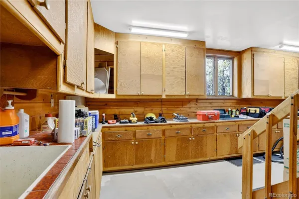 a view of a room with wooden walls